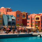 panoramic seascape on colorful Marina promenade street from Red Sea with moored motor yachts. Marina, Hurghada, Egypt | Von Oles